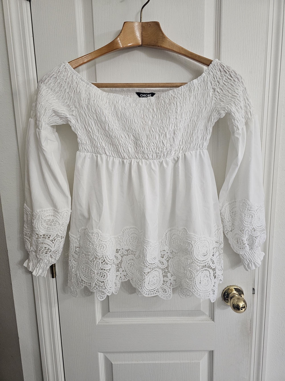Chic White Off-Shoulder Smocked Blouse with Crochet Hem